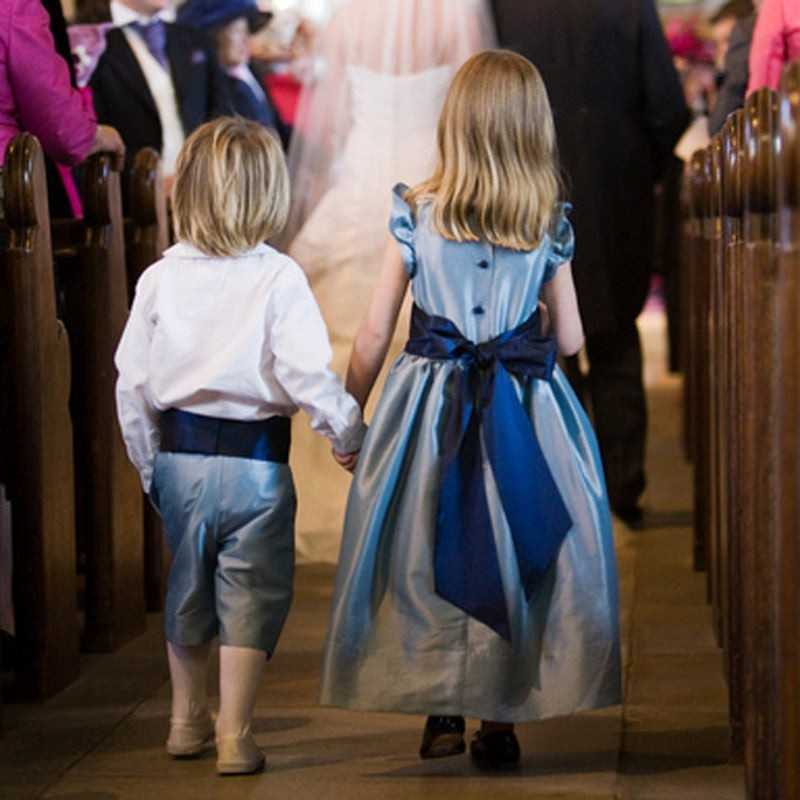 Isobel frill sleeves flower girl dress in pale blue with navy sash by Little Eglantine