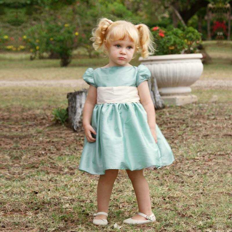 Emilie sage green knee length designer flower girl dress the perfect fit for a royal wedding! designer Little Eglantine