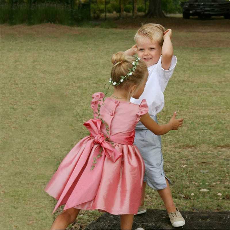 Isabella designer knee length flower girl dress with flounce sleeves in pink by French UK royal designer Little Eglantine