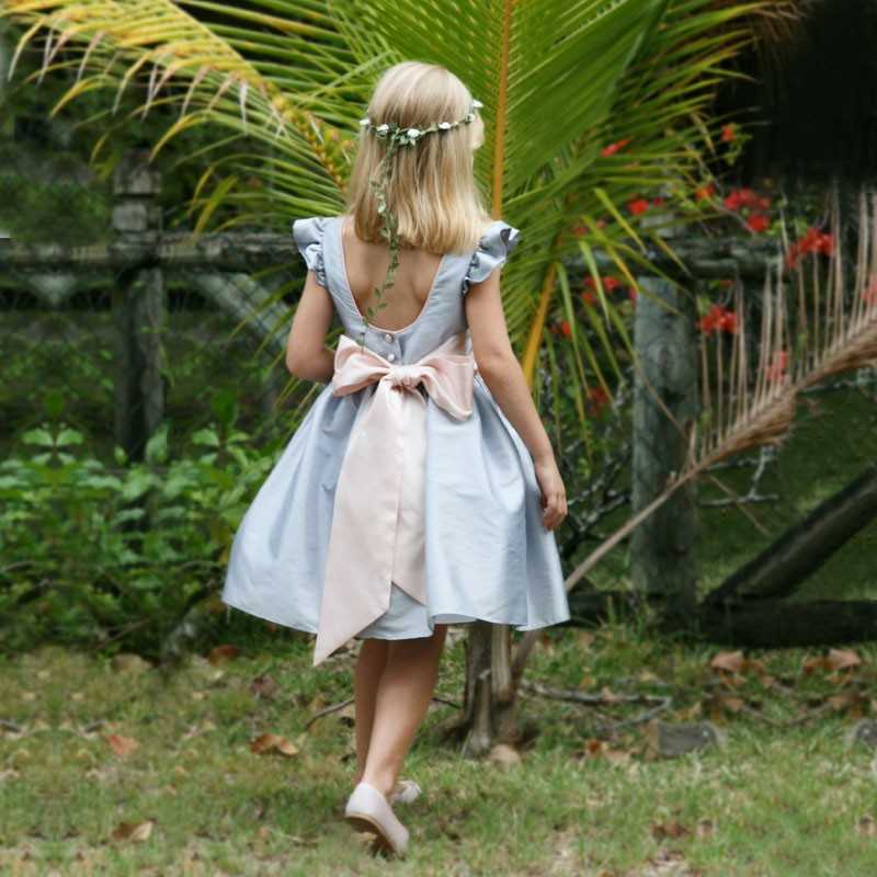 Emmanuelle silver knee length flower girl dress with deep back and frill sleeves by royal designer little eglantine