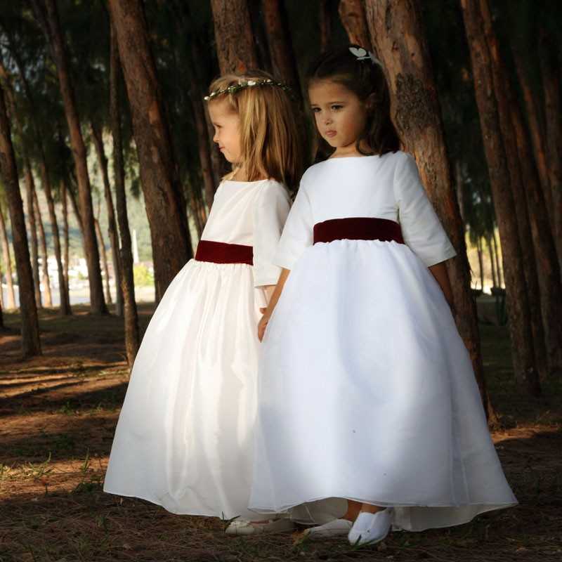 White and burgundy velvet flower girl dress by French designer Little Eglantine