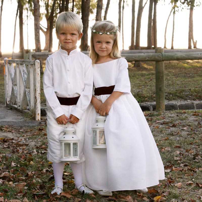 White flower girl dress with burgundy velvet sash and covered buttons with 3/4 length sleeves by Little Eglantine