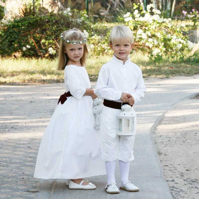 White flower girl dress with burgundy velvet sash and covered buttons with 3/4 length sleeves by Little Eglantine