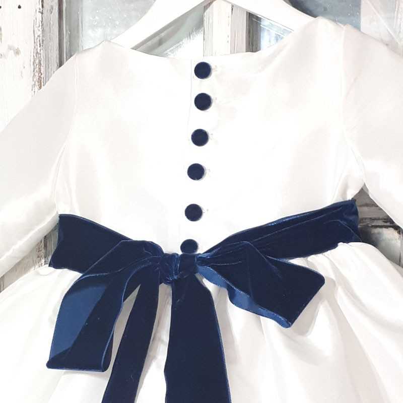 White and navy blue velvet flower girl dress by French designer Little Eglantine