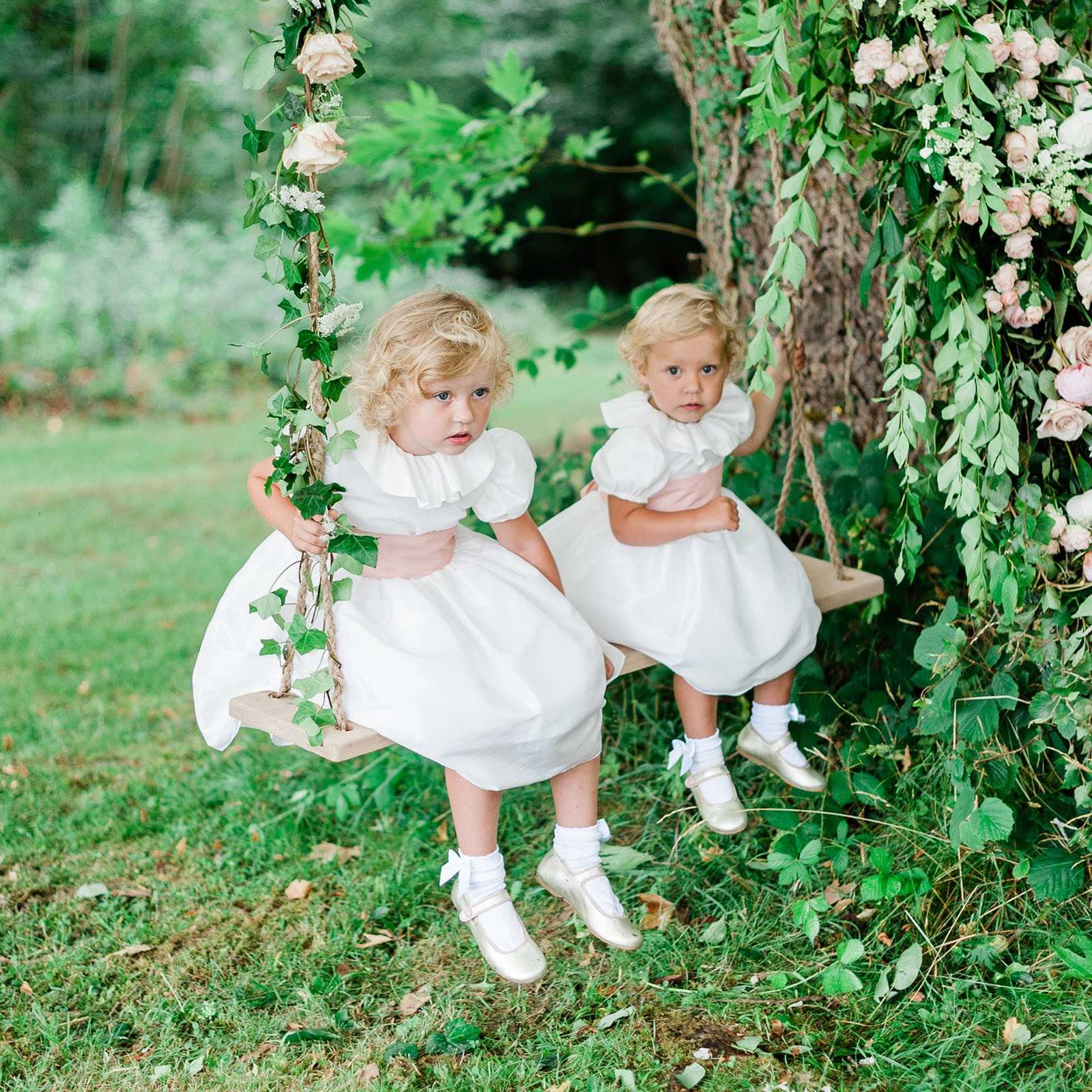 Eulalie white flower girl dress with puff sleeves and ruffled collar by Royal designer Little Eglantine