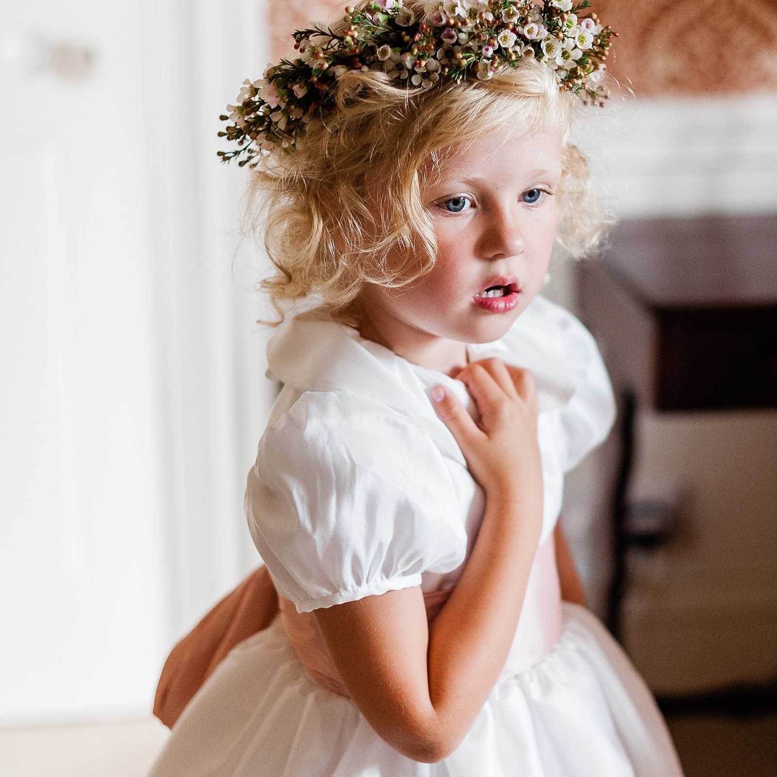 Eulalie white flower girl dress with puff sleeves and ruffled collar and pink sash by Royal designer Little Eglantine