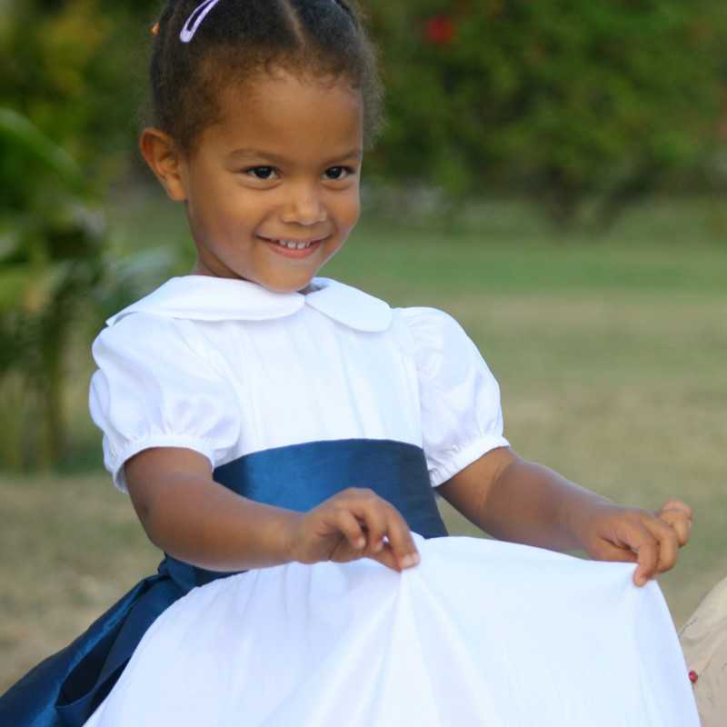 Gallia white flower girl dress with peter pan collar and puff sleeves  with navy blue sash - designer flower girl dresses UK