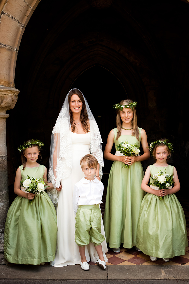 Green flower girl dresses and page boy outfits by Little Eglantine