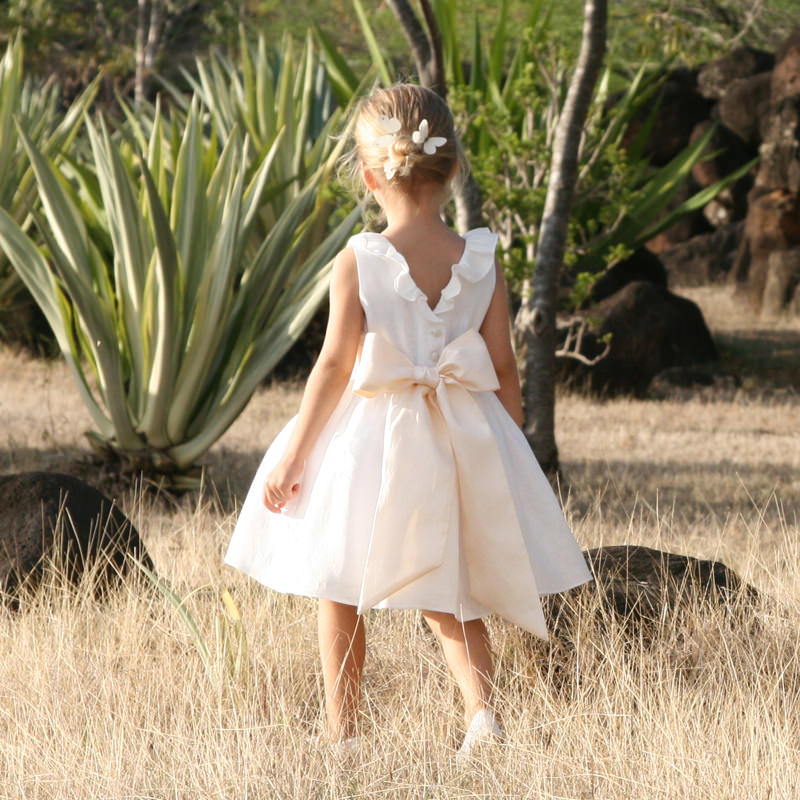 Erika ivory linen flower girl dress with cream sash and flounce collar and V back by French designer Little Eglantine