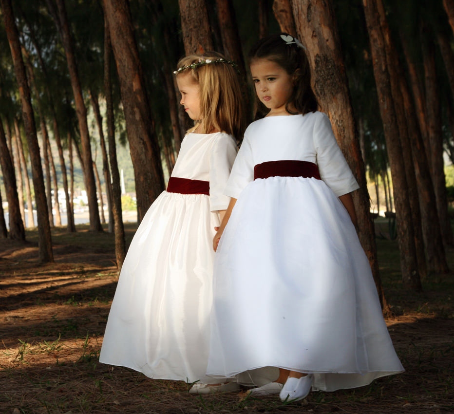 Ines and Camille white flower girl dresses with burgundy velvet ribbon by French designer Little Eglantine 