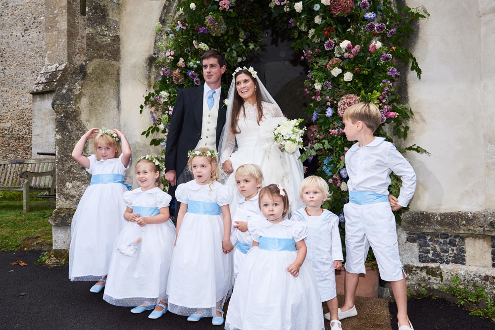 Real wedding white and pale blue flower girl dresses and page boy outfits by French designer Little Eglantine