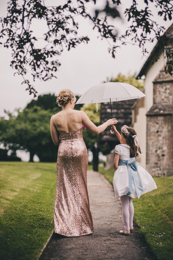 Traditional white flower girl dress with pale blue sash for a countryside wedding by Royal French designer Little Eglantine - knee length dress with peter pan collar and puff sleeves