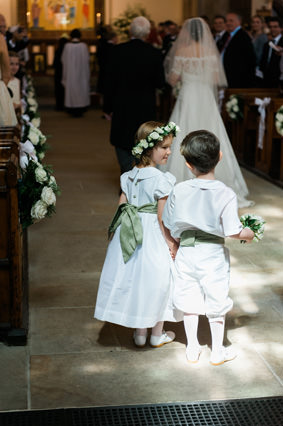 White and pale green flower girl and page boy by Little Eglantine